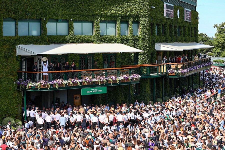 Kazakhstan's Elena Rybakina celebrates with the Venus Rosewater Dish trophy at Wimbledon 2022