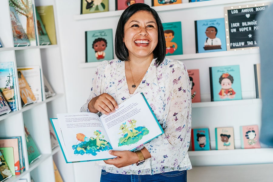 
Laura Rodríguez-Romaní, a former dual language elementary school teacher in her Los Amigos Books, which specializes in English and Spanish language children’s books, at the Berwyn Shops retail incubator in Berwyn, Ill., June 30, 2022. More than 300 new independent bookstores that have sprouted across the U.S. in the past couple of years, in a surprising and welcome revival after an early pandemic slump. (Jamie Kelter Davis/The New York Times)