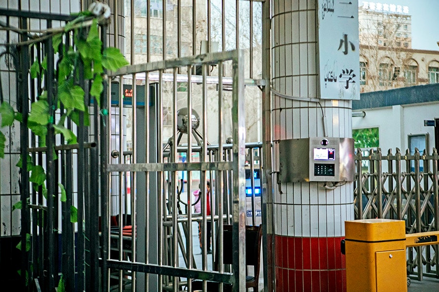 A device for facial recognition at the entrance of a primary school in Hotan, in the western region of Xinjiang, China, on Dec. 11, 2019. As China builds up its vast surveillance and security apparatus, it is running up against growing public unease about the lack of safeguards to prevent the theft or misuse of personal data. (Giulia Marchi/The New York Times) 