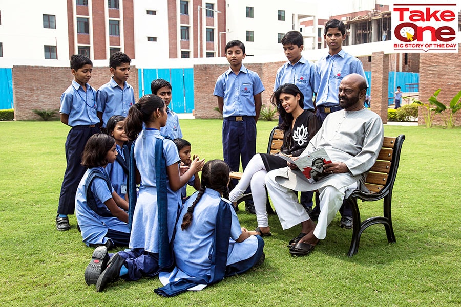 Shiv Nadar, founder and chairman emeritus of HCL Technologies Ltd. and the Shiv Nadar Foundation and Roshni Nadar, chairperson of HCL Technologies Ltd. with the students of VidyaGyaan School in Noida. The father and daughter are the second biggest family philanthropic donors in India. Image: Udit Kulshrestha