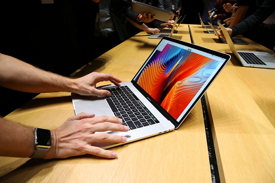 A new MacBook Pro model during an unveiling at Apple headquarters in Cupertino, Calif., Oct. 27, 2016. Apple proposed a  million settlement on July 18, 2022, for defective MacBook keyboards, in response to a class-action lawsuit by customers who sought repairs for the butterfly keyboard, released in certain laptops from 2015 to 2019. (Jim Wilson/The New York Times)