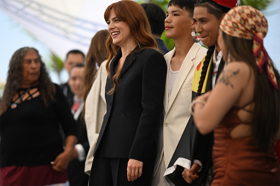 US director and actress Riley Keough poses with cast members during a photocall for the film 