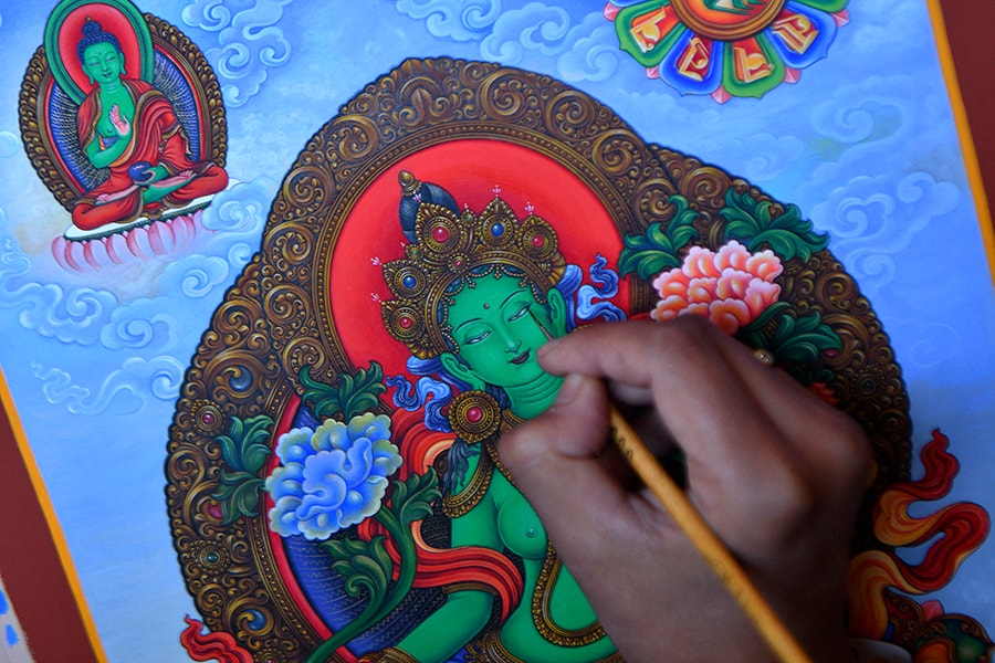 Paubha artist Ujay Bajracharya works on his rendition of the Green Tara, a goddess of compassion revered by Buddhists and Hindus in the country, in Lalitpur on the outskirts of Kathmandu.
Image: Prakash Mathena/ AFP