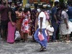 Sri Lankans stand, sweat and seethe as economy grinds to a halt