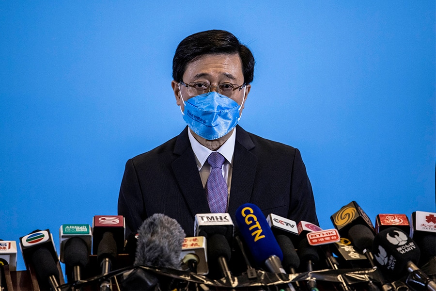 Hong Kong's next leader John Lee is inheriting a once vibrant Asian business hub mired in its third year of pandemic isolation but he may prioritise security over an economic reboot, business leaders and observers say. (Credits: ISAAC LAWRENCE / AFP)

