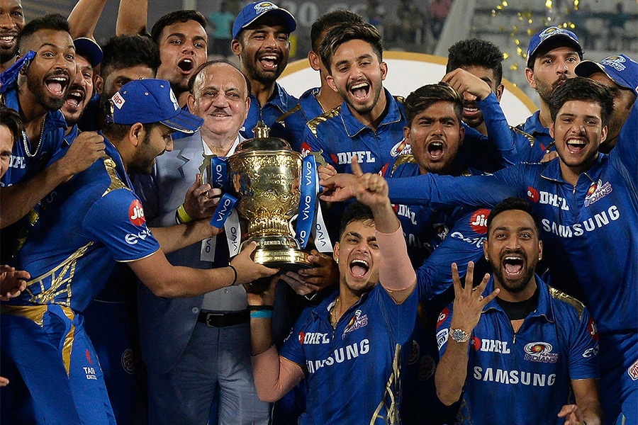 Team Mumbai Indians with the trophy of the Indian Premier League (IPL). (Credits: NOAH SEELAM/ AFP)