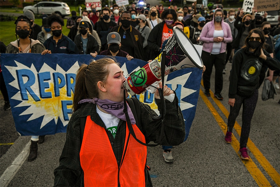 Demonstrators march to Justice Samuel Alito’s home for a candlelight vigil as part of an abortion rights protest, in Alexandria, Va., May 9, 2022. The demonstrations outside Supreme Court justices’ homes have sparked a debate over what counts as appropriate forms of protest in a deeply polarized country. Image: Kenny Holston/The New York Times