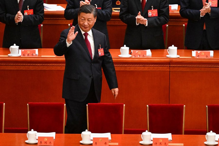 China's President Xi Jinping waves as he arrives for the opening session of the 20th Chinese Communist Party's Congress at the Great Hall of the People in Beijing on October 16, 2022. Image: Noel Celis/AFP 