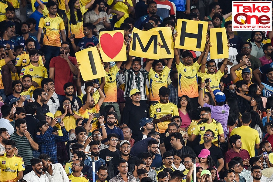 Cheering cricket fans at an Indian Premier League (IPL) Twenty20 cricket match between Gujarat Titans and Chennai Super Kings at the Narendra Modi Stadium in Ahmedabad on March 31, 2023.
Image: Punit Paranjpe / AFP