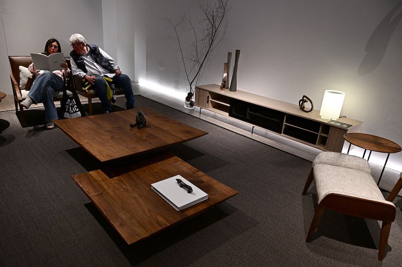 People visit the stand of Japanese brand Ritzwell at the Salone del Mobile furniture fair in Milan.
Image: Gabriel Bouys / AFP 