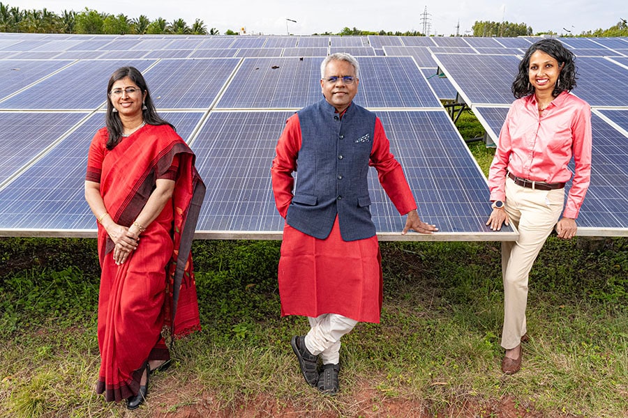 (L to R) Lakshmi Santhanam, Balaji Lakshmikanth Bangolae and Deepika Gopal, Co-founders of RenKube  at a solar field in Karnataka.
Image: Selvaprakash Lakshmanan for Forbes India