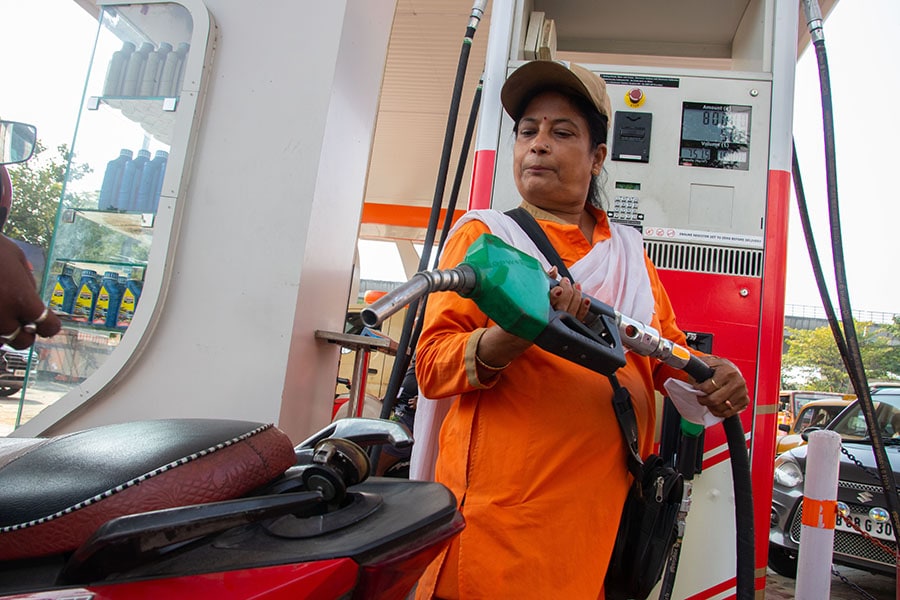 (File photo)Female staff working at an Indian Oil petrol pump. Image: Debajyoti Chakraborty/NurPhoto via Getty Images