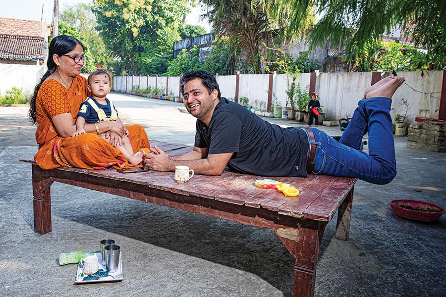 Shailesh Kumar, founder & CEO, CABT Logistics, with his mother in the courtyard of the house he was born in, in Morwa Raytol in Samastipur district, Bihar
Image: Madhu Kapparath