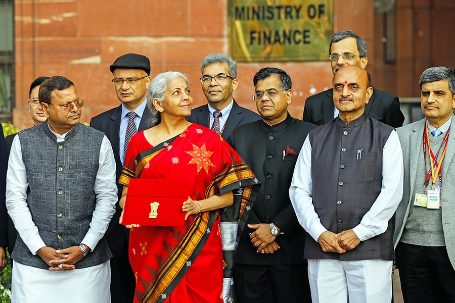 Finance Minister Nirmala Sitharaman holds up a folder with the Government of India's logo as she leaves the ministry to present the budget at the parliament in New Delhi, India, on February 01, 2023. Image: Amarjeet Kumar Singh/Anadolu Agency via Getty Images