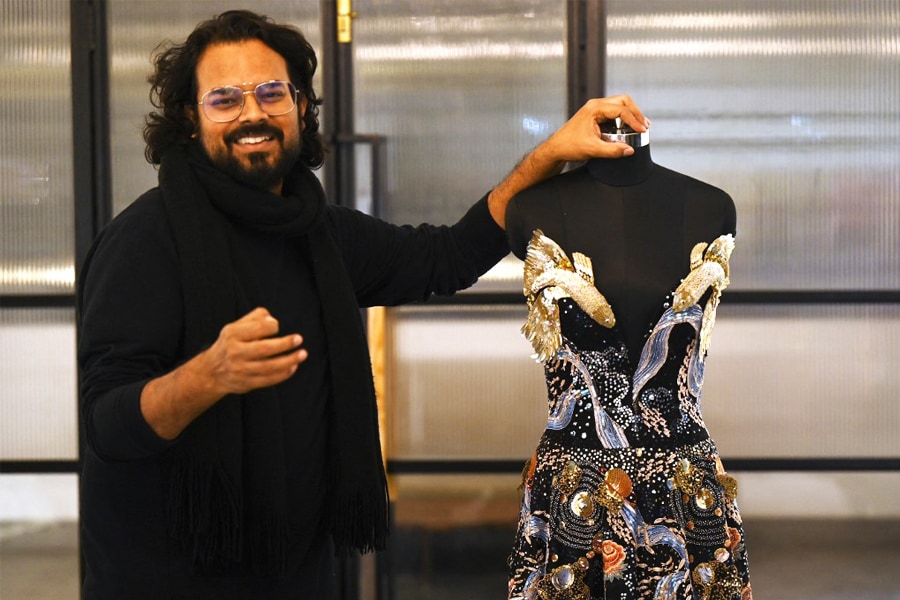 In this photograph taken on January 13, 2023, Indian fashion designer Rahul Mishra stands beside his new collection at his workshop in Noida. - For a man with seemingly infinite creative ambitions, it is fitting that Indian designer Rahul Mishra's latest Paris haute couture collection attempts to encapsulate the entire universe.
Image: Money Sharma / AFP