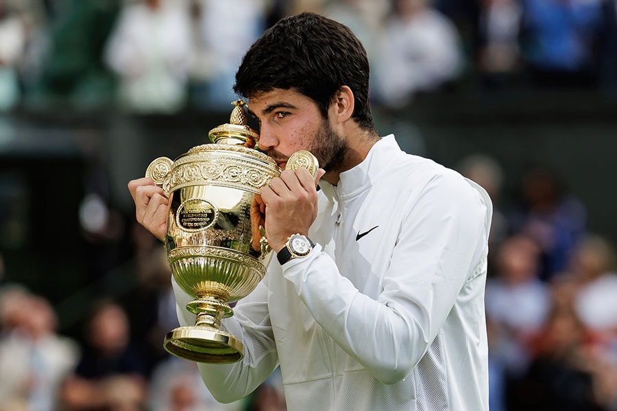 Carlos Alcaraz of Spain poses with the winner's trophy after his victory over Novak Djokovic of Serbia in the final of the men's singles during day fourteen of The Championships Wimbledon 2023 at All England Lawn Tennis and Croquet Club on July 16, 2023 in London, England.
Image: Frey/TPN/Getty Images