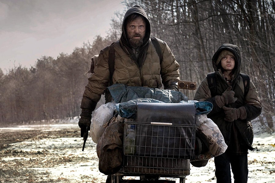 Viggo Mortensen as the man and Kodi Smit-McPhee as the boy in 2009 film adaptation of 'The Road'