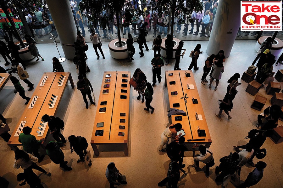 Visitors take a look at the various products on display at the inauguration of Apple’s first retail outlet in Mumbai; Image: Anshuman Poyrekar/HT via Getty Images