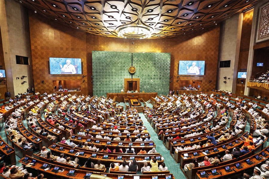 PM Modi addressing MPs in the new Parliament building. Image: Photo by PIB / AFP