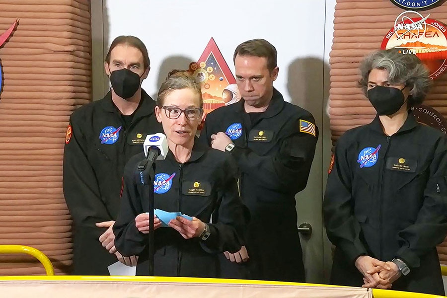 In this still image taken from a July 6, 2024, NASA TV broadcast, volunteer crew commander Kelly Haston speaks alongside crewmates (L-R) Ross Brockwell, Nathan Jones and Anca Selariu, as they exit the first simulated yearlong Mars habitat mission at Johnson Space Center in Houston, Texas. - The crew's mission began in the 3D printed Mars habitat on June 25, 2023. Image: Jose Romero / NASA TV / AFP) 