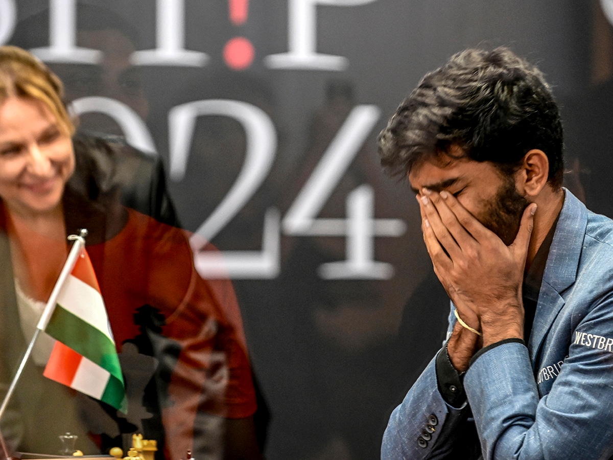  India's grandmaster Gukesh Dommaraju (R) reacts after winning against China's chess grandmaster Ding Liren in game 14 of the 2024 FIDE World Championship in Singapore on December 12, 2024. Image: Simon Lim / AFP