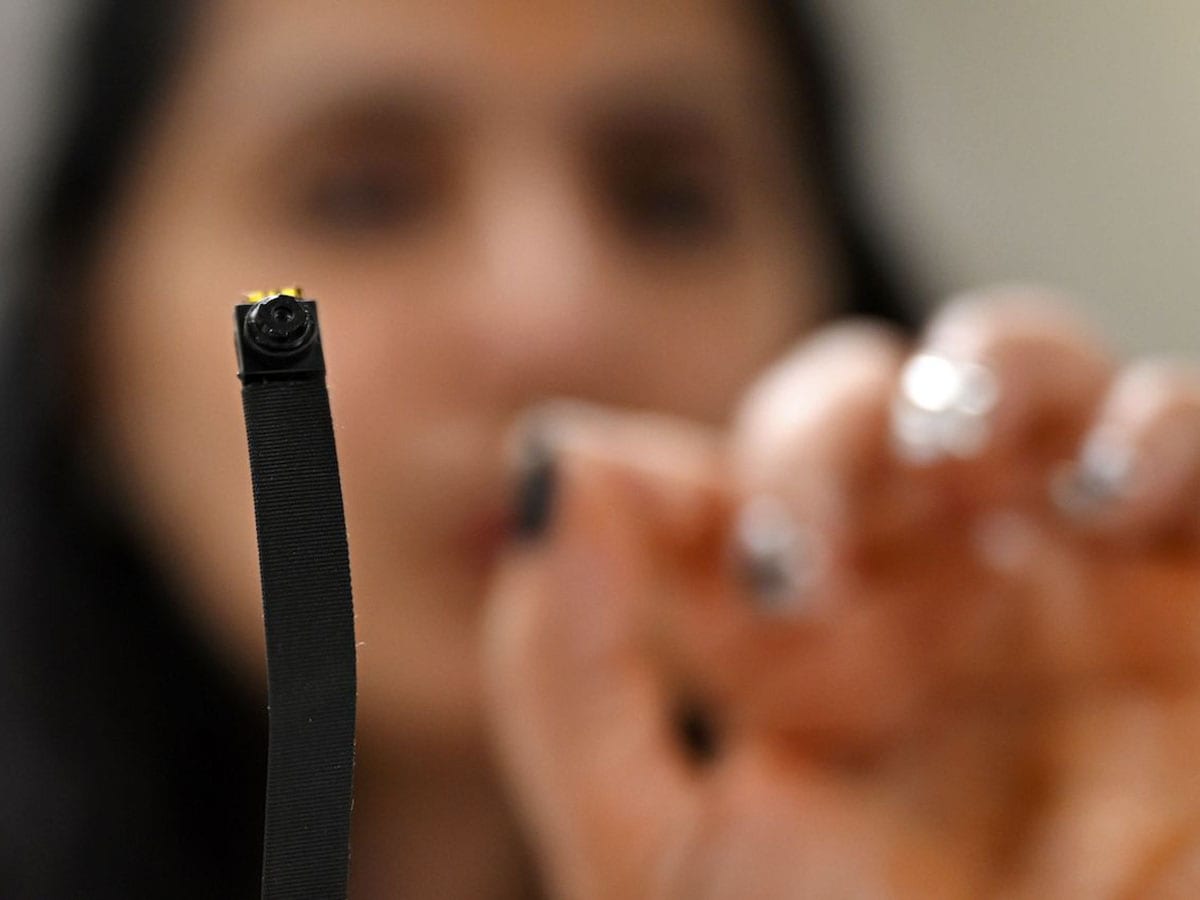 In this photograph taken on December 7, 2024, Akriti Khatri, founder of Venus Detective Agency, shows a spy camera during an interview with AFP in New Delhi. Image: Arun SANKAR / AFP