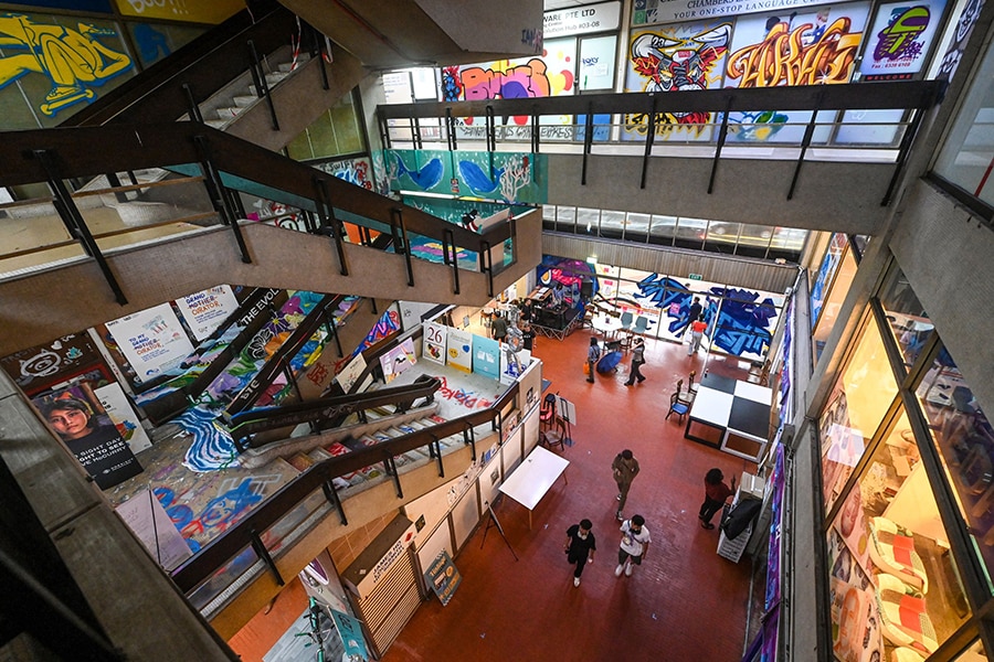  People visit the Peace Centre, an abandoned mall turned into an unexpected art enclave, in Singapore.
Image: Roslan Rahman / AFP
