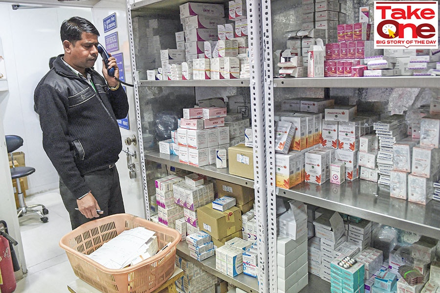 A file photo shows an employee with a pharmacy taking an order for generic drugs for a client in New Delhi.
Image: Prakash Singh / AFP 