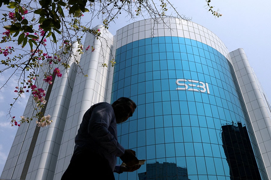 A man walks past the Securities and Exchange Board of India (SEBI) headquarters in Mumbai, India. Image: Reuters/Francis Mascarenhas/File Photo 