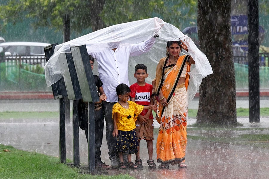 People enjoying rain at Kartavya Path on June 29, 2024 in New Delhi, India. Image: Sonu Mehta/Hindustan Times via Getty Images