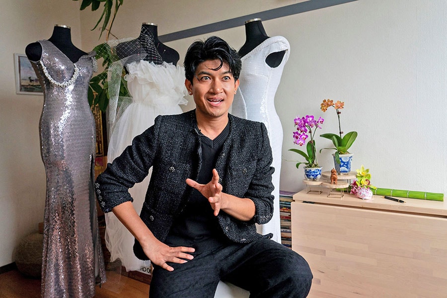 Myanmar-born fashion designer Shibuya Zarny speaking in an interview with AFP at his workshop in Tokyo
Image: Kazuhiro Nogi / AFP©