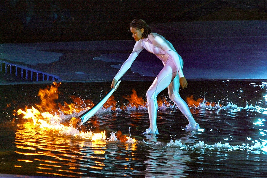 
Australian sporting icon Cathy Freeman lights the Olympic cauldron 15 September, 2000 in Sydney to ignite the 27th Olympiad of the modern era. 
Image: Kazuhiro Nogi / AFP©