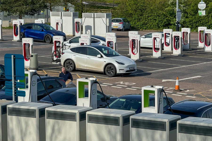 Electric cars including Teslas recharge at a charging area of a motorway service station on April 13, 2024 in Exeter, England. The European Union plans to ban all new sales of carbon-emitting petrol and diesel cars by 2035. Originally the UK planned to ban the sale of new petrol and diesel cars in Britain will by 2030, however this has recently put back still further.
Image: Matt Cardy/Getty Images