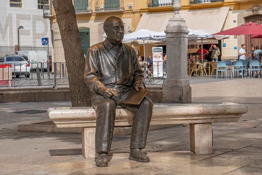 Capturing the essence of a genius, this bronze statue of Pablo Picasso in Malaga pays tribute to the city's most illustrious son, immortalizing the artist in his hometown's vibrant streets.
Image: Shutterstock