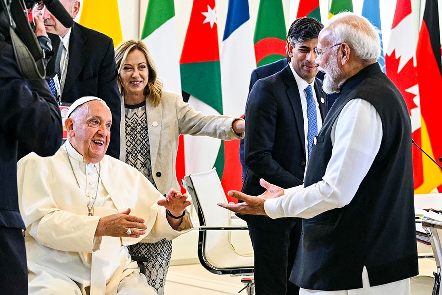 Pope Francis greets Indian Prime Minister Narendra Modi before a working session on Artificial Intelligence (AI), Energy, Africa and the Mediterranean at the Borgo Egnazia resort during the G7 Summit in Savelletri, near Bari in Italy, on June 14, 2024.
Image: Mandel Ngan/ AFP