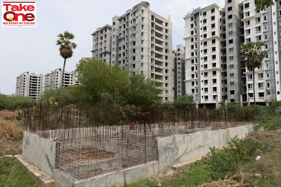 Abandoned half-constructed buildings on farmland, where two types of crops were grown a year, with dug-up approach roads lined on either side with weeds and thickets. Image: Vikas Chandra Pureti for Forbes India