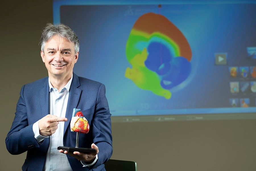 Pascal Daloz, CEO, Dassault Systèmes holding a 3D-printed heart. About seven years back, the life sciences sector was only 5 percent of the company's total revenue, today it is 25 percent. Image: Nishant Ratnakar for Forbes India