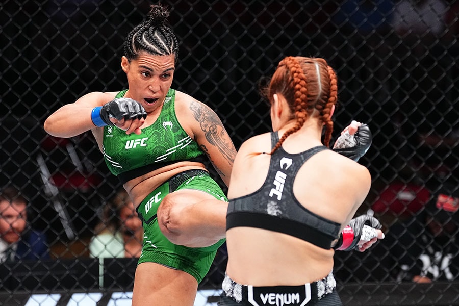 Puja Tomar of India reacts after her victory against Rayanne dos Santos of Brazil in a strawweight fight during the UFC Fight Night event at KFC YUM! Center on June 08, 2024 in Louisville, Kentucky.
Image: Jeff Bottari/Zuffa LLC via Getty Images 