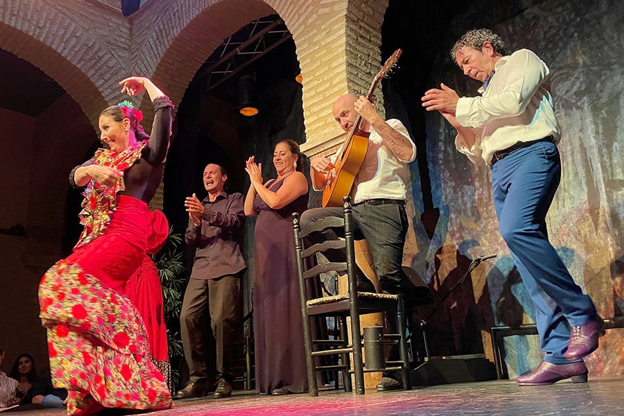 The Spanish guitar's evocative strains, intense footwork, and flamenco artistry create an unforgettable experience at the Flamenco Dance Museum in Seville, where dancers captivate audiences for an hour, immersing them in a whirlwind of sensations. Image: Veidehi Gite