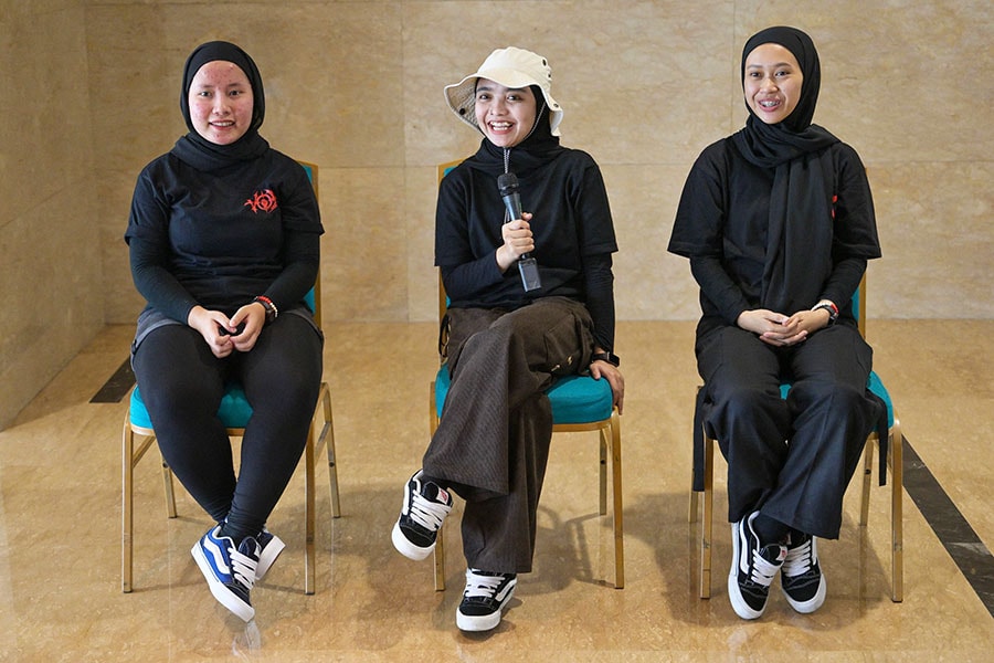 Members of the Indonesian metal band Voice of Baceprot (VOB); vocalist and guitarist Firda Kurnia (C), bassist Widi Rahmawati (R), and drummer Euis Siti Aisah (L)
Image: Bay Ismoyo / AFP©
