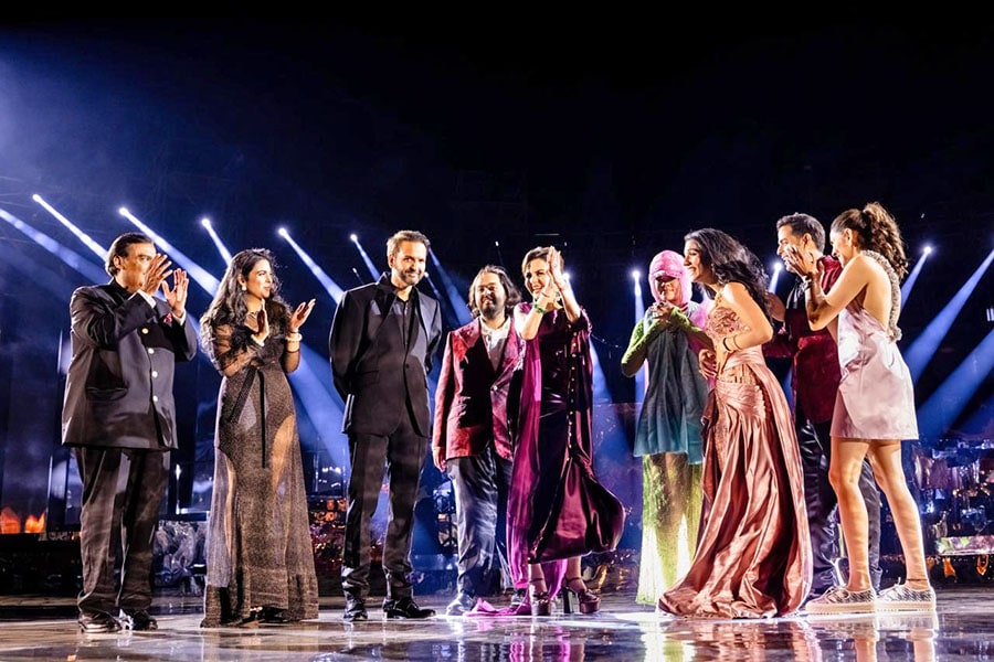 (L-R)Reliance Industries chairman Mukesh Ambani with Isha Ambani, Anand Piramal, Anant Ambani, Nita Ambani, Singer Rihanna, Radhika Merchant, Akash Ambani, and Shloka Ambani.