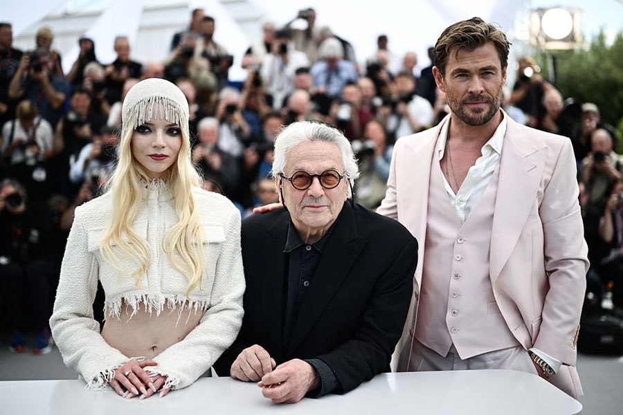 (FromL) British-US actress Anya Taylor-Joy, Australian director and screenwriter George Miller and Australian actor Chris Hemsworth pose during a photocall for the film 