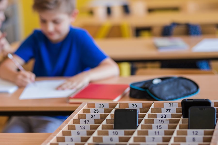 Right now, pupils in French middle schools must turn off their phones. The experiment takes things further, requiring children to hand in their phones on arrival. Image: Dobrila Vignjevic/Getty Images 