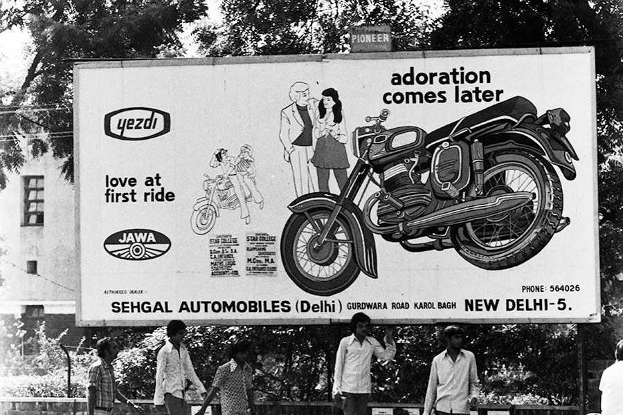 A billboard advertising Indian-made Yezdi Motobike to attract young men in central New Delhi, May 8, 1975. Ideal Jawa decided to sell motorcycles under the name ‘Yezdi’ with technical assistance from Jawa in 1971. Image: Sondeep Shankar/Getty Images