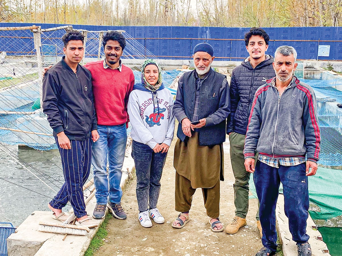 Zarin’s co-founders Saurav Satish (second from left), Rifat Amin Lone (third from left) and Syed Faaiz Qadri (fifth from left) along with fish farmers