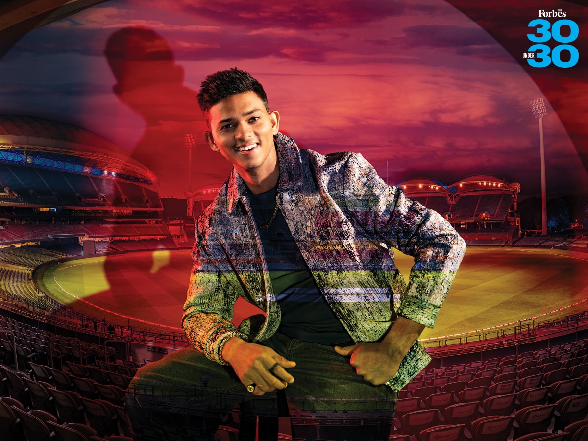 

Indian cricketer, Yashasvi Jaiswal
Image: Neha Mithbawkar For Forbes India; Imaging By Kapil Kashyap; Background Image: Shutterstock
Outfit: ‘Coastal Odyssey’ Jacket, ‘Script Spray Paint’ Tee, Both The Khwaab; ‘Midnight Flared Jeans, Overbar; Golden Tone Chain, Bracelet, Mesh Ring, Wayfinder Compass Signet Ring, All Inox Jewelry.
Styled By Lehan Devadhia, Assisted By Asmita Bhosle; Makeup And Hair: Sanah Kewal