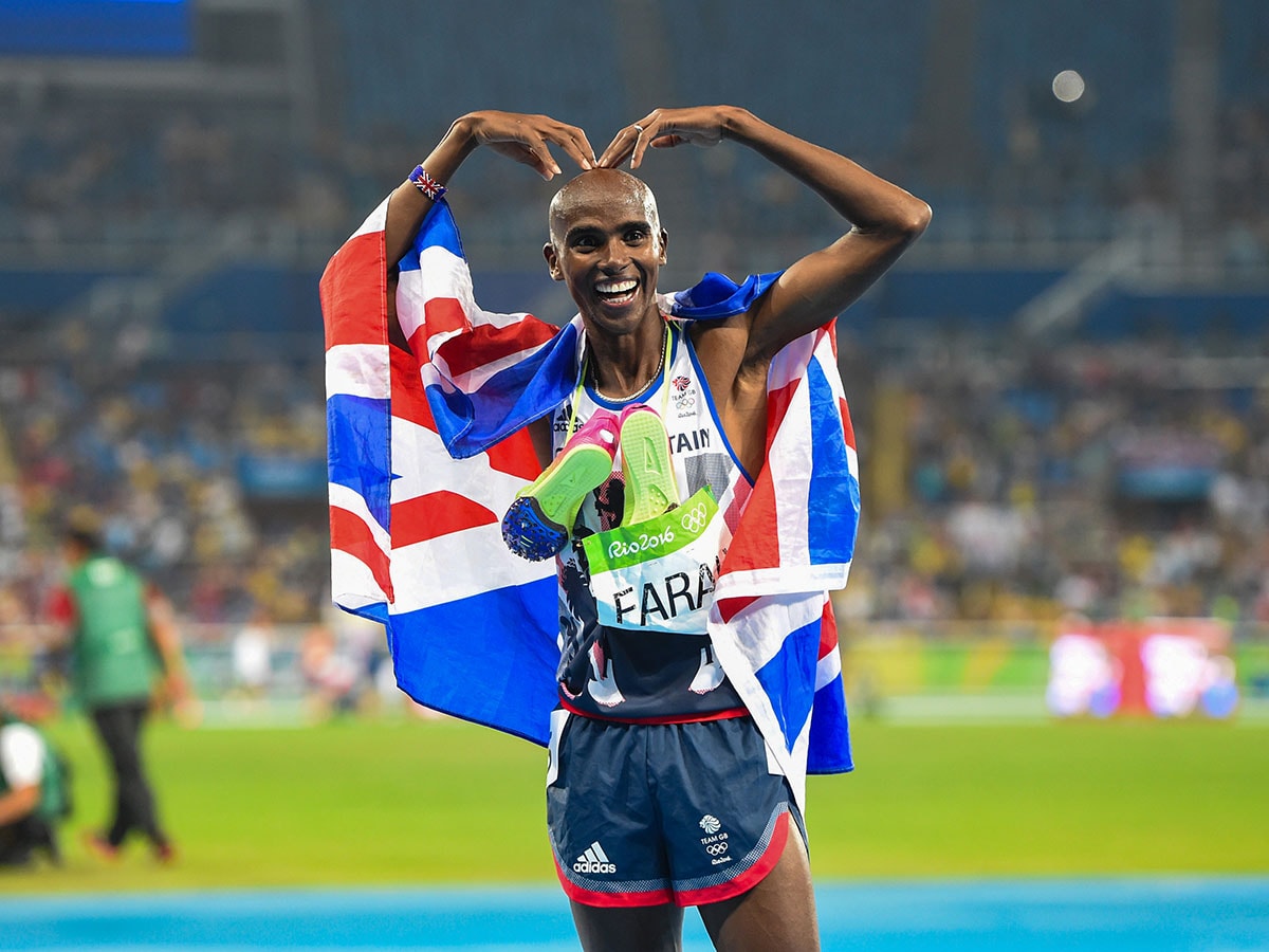 Image: Mo Farah strikes the Mobot, his trademark celebratory pose, after winning the 5,000m gold in the 2016 Rio Olympics. With four gold medals—in 5,000m and 10,000m in consecutive Olympics—Farah is considered to be one of the greatest distance runners. 
Image: Jeremy Selwyn/Evening Standard via Getty Images