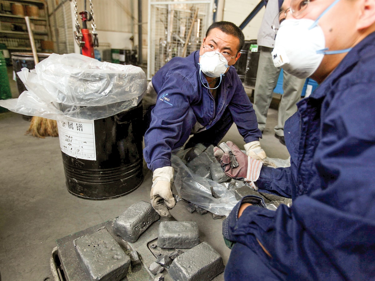 A file photo of workers handling neodymium ingots at Neo Material Technologies Inc’s Magnequench factory in Tianjin, China
Image: Doug Kanter / Bloomberg Via Getty Images