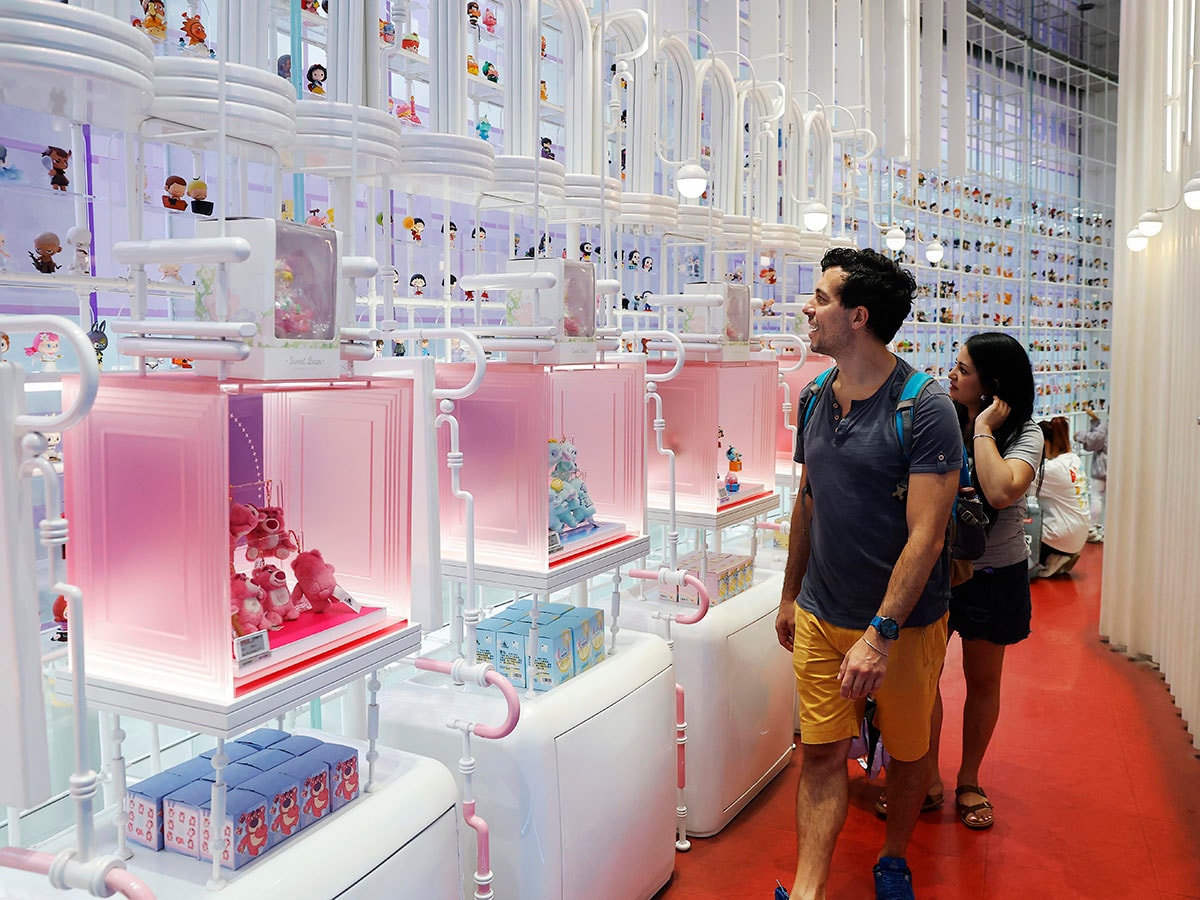 People shop at the Pop Mart's global flagship store in Shanghai, also the largest offline retail store in the world,in China on June 11, 2025. Pop Mart shares surged nearly 200% in 2025, driven by strong demand for Labubu dolls. Image: Yin Liqin/CNS/VCG via Getty Images
