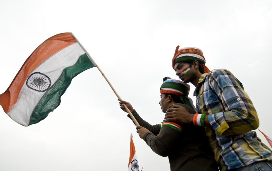 Young men wave the Indian flag on Day 9 of Anna’s fast                                        